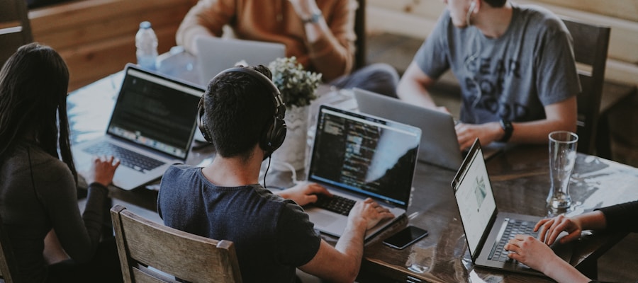 Software development team collaborating with AI tools in modern office